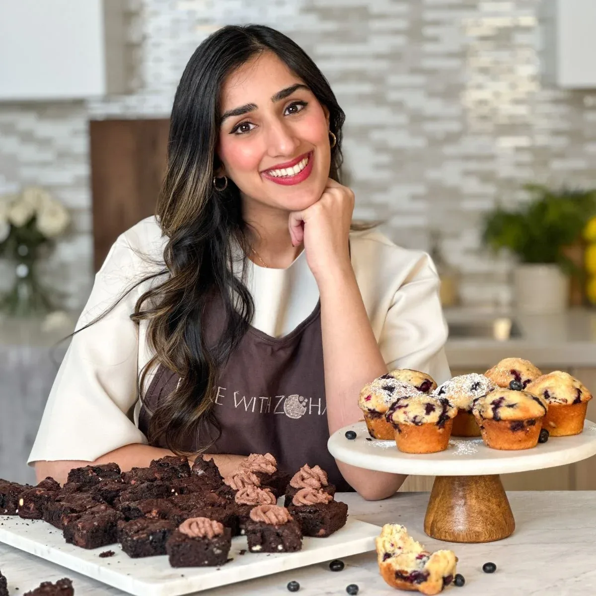 Zoha Malik at a dessert table