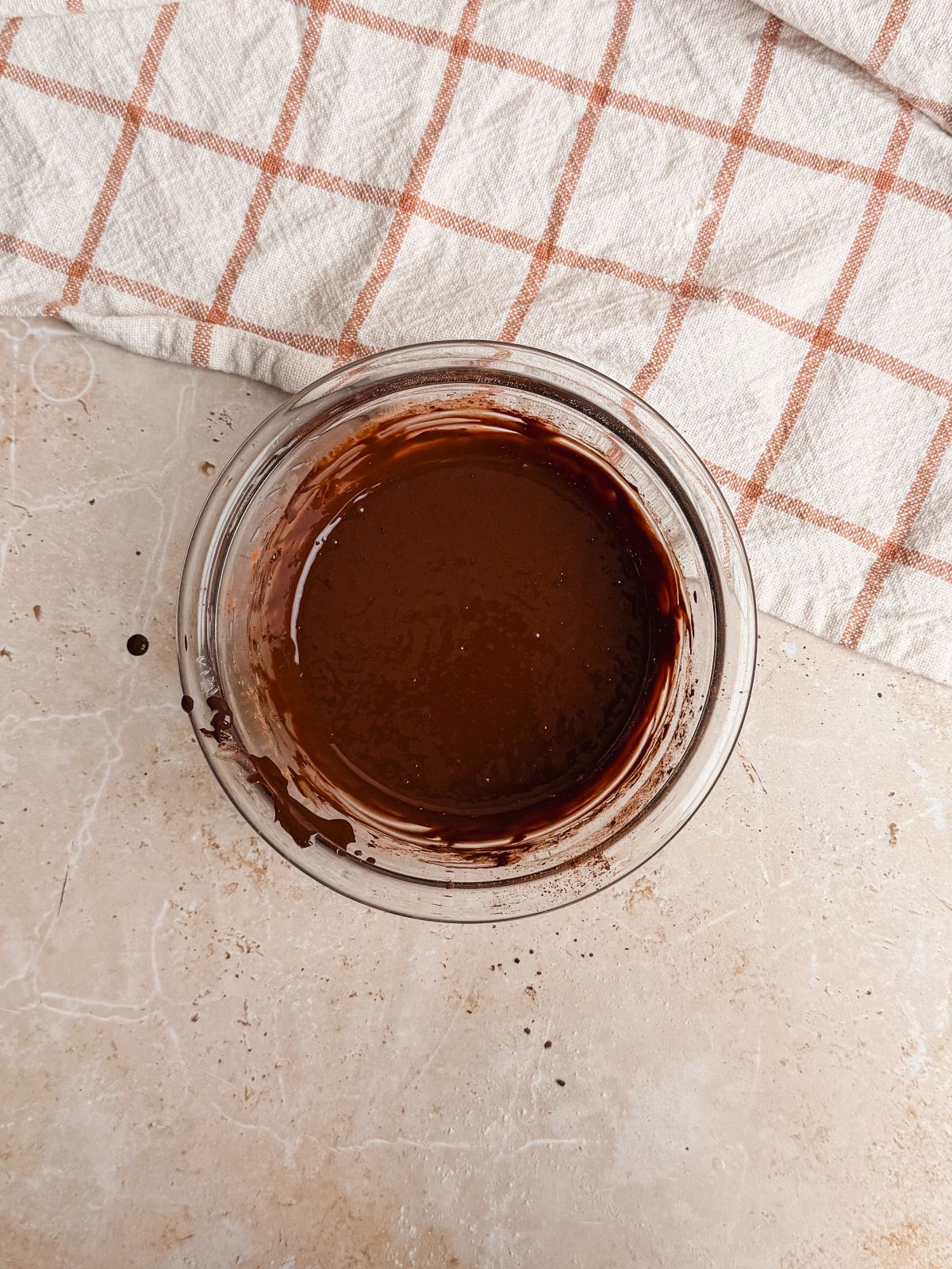 small glass bowl with a mixture of cocoa powder and water