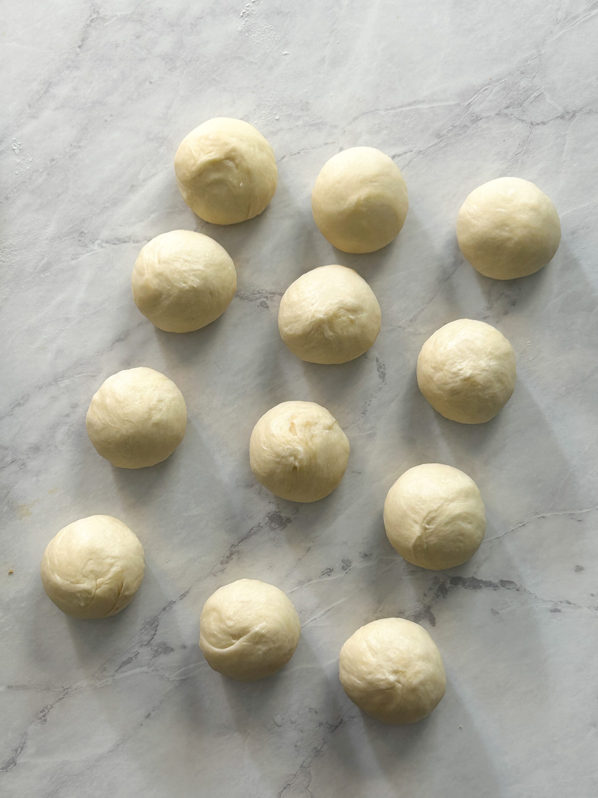 12 dough balls for kachoris laid out neatly