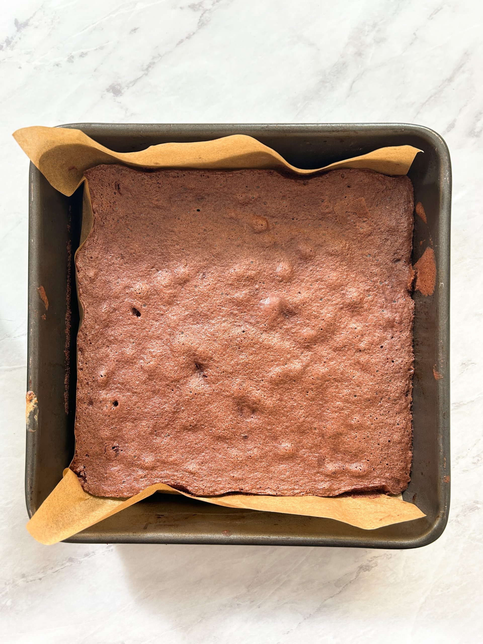 baked chocolate sponge cake in a pan