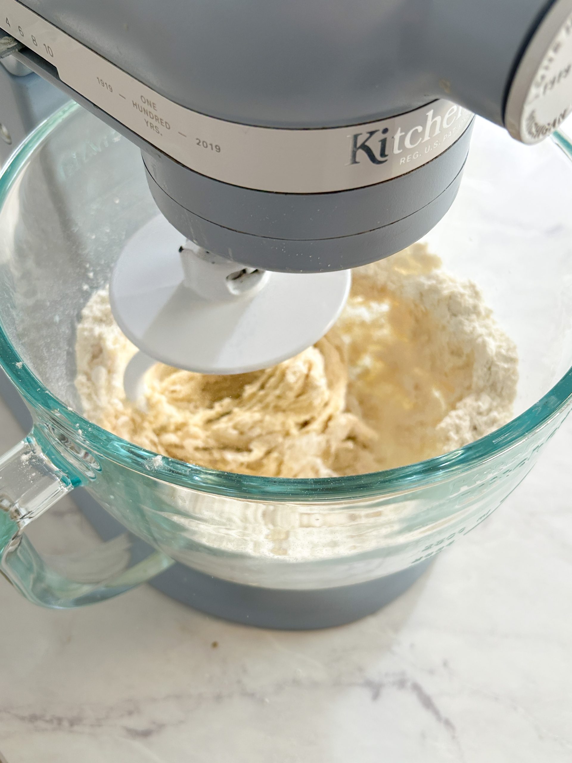 kitchen aid mixer making bread dough with dough hook attachment
