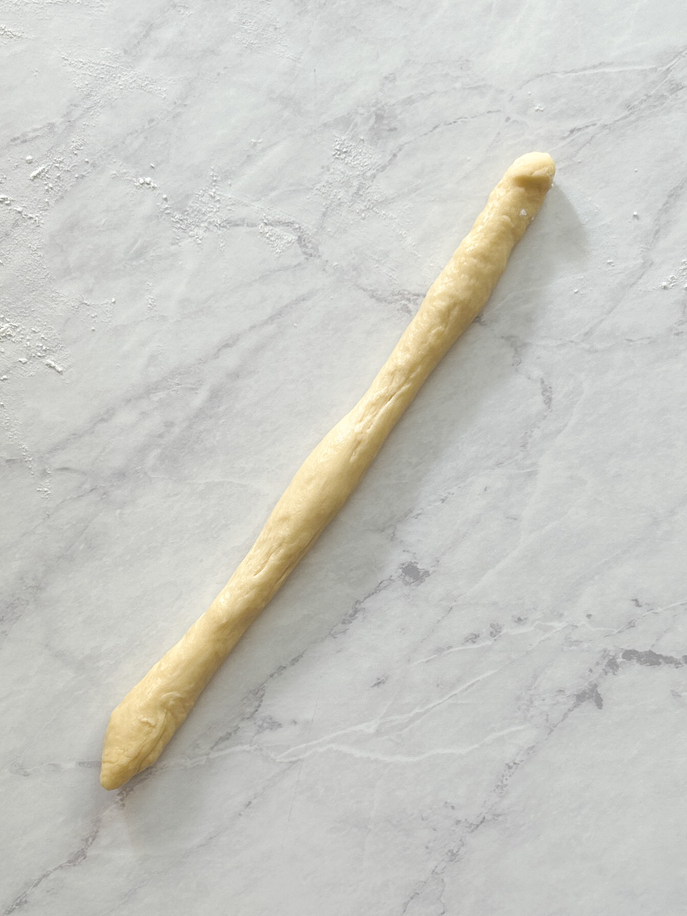 piece of dough rolled out into a long strip