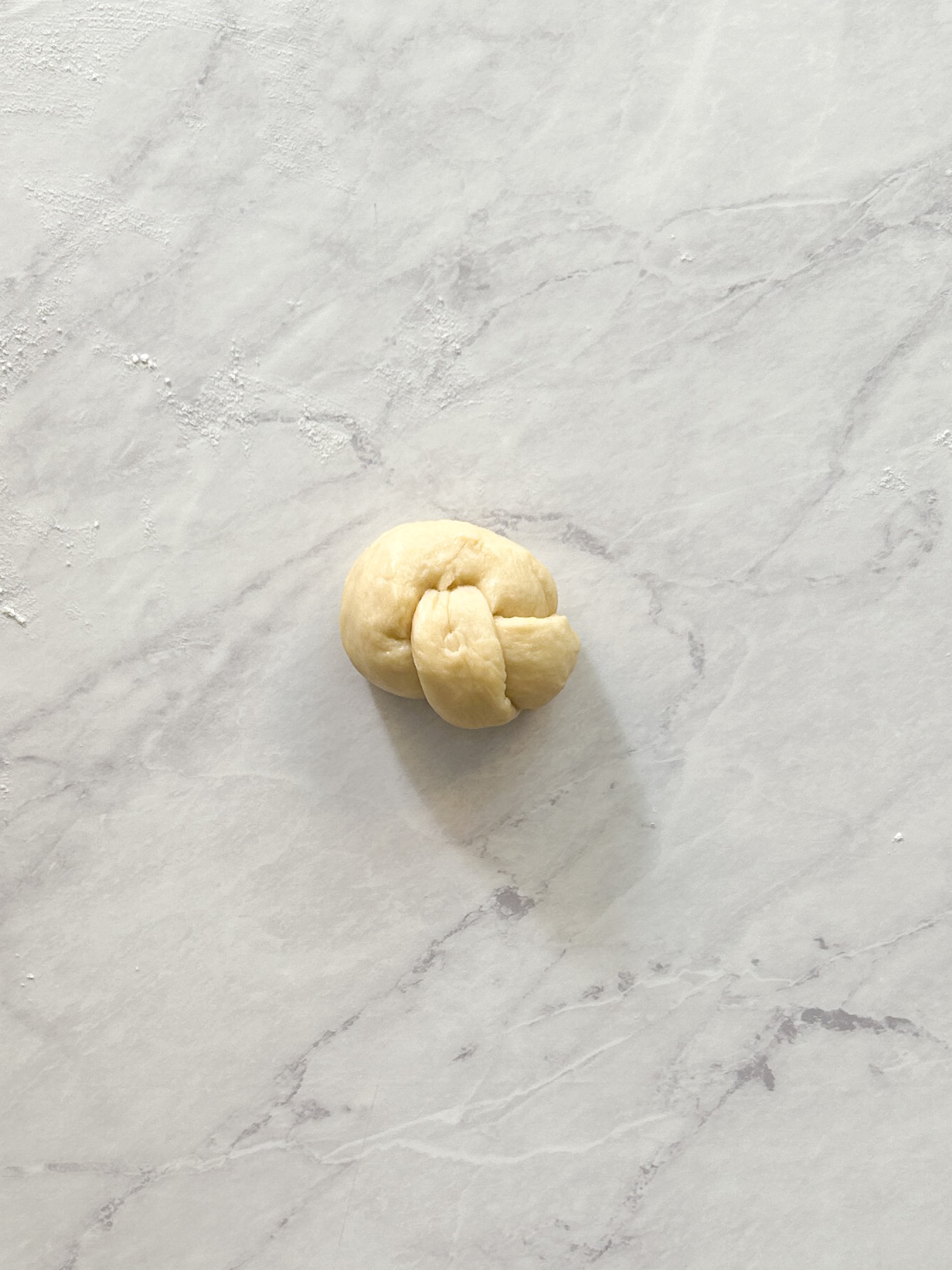 other end of garlic knot tucked in to make proper garlic knot shape