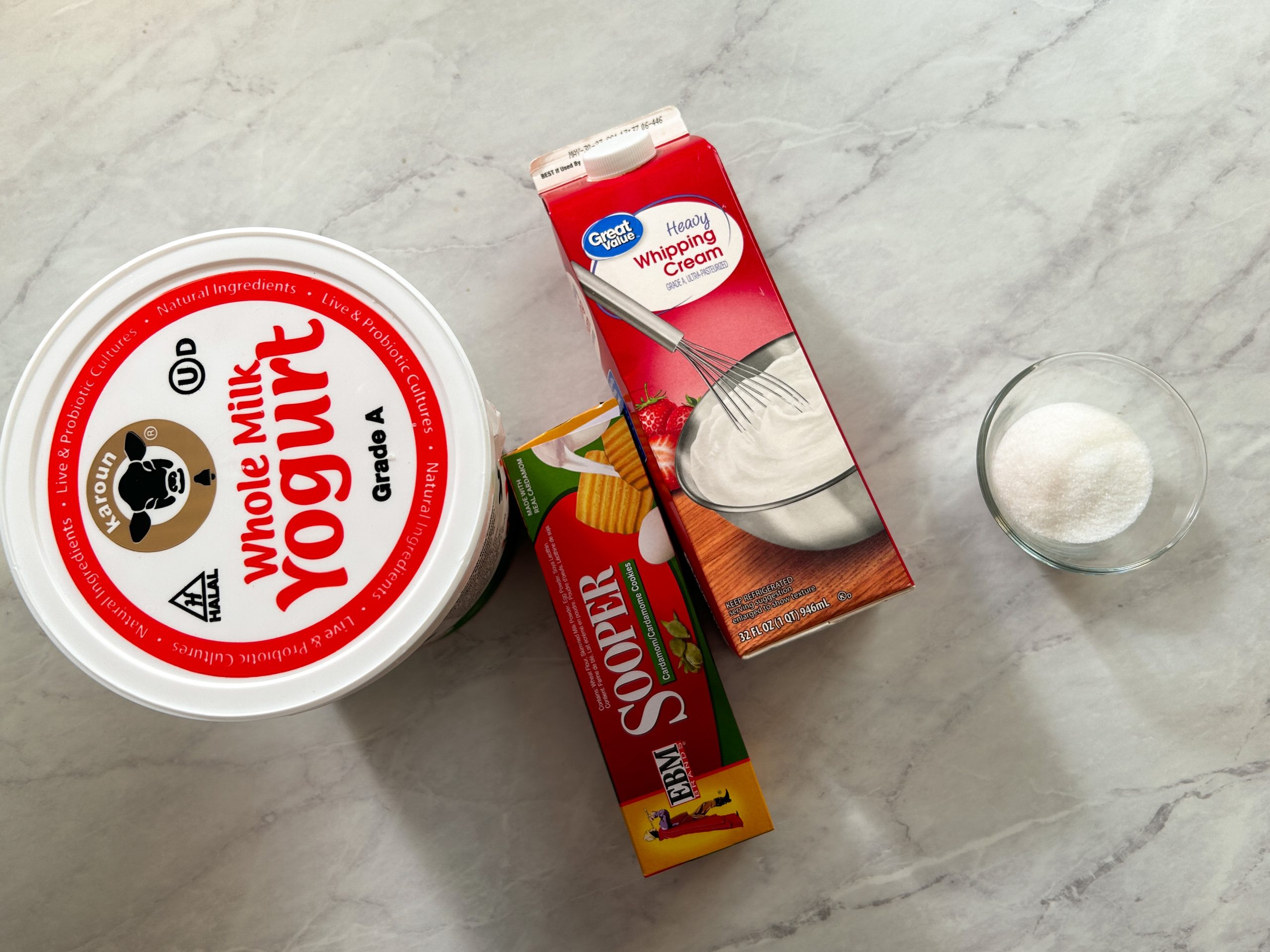 yogurt parfait ingredients: yogurt, cream, biscuits and sugar