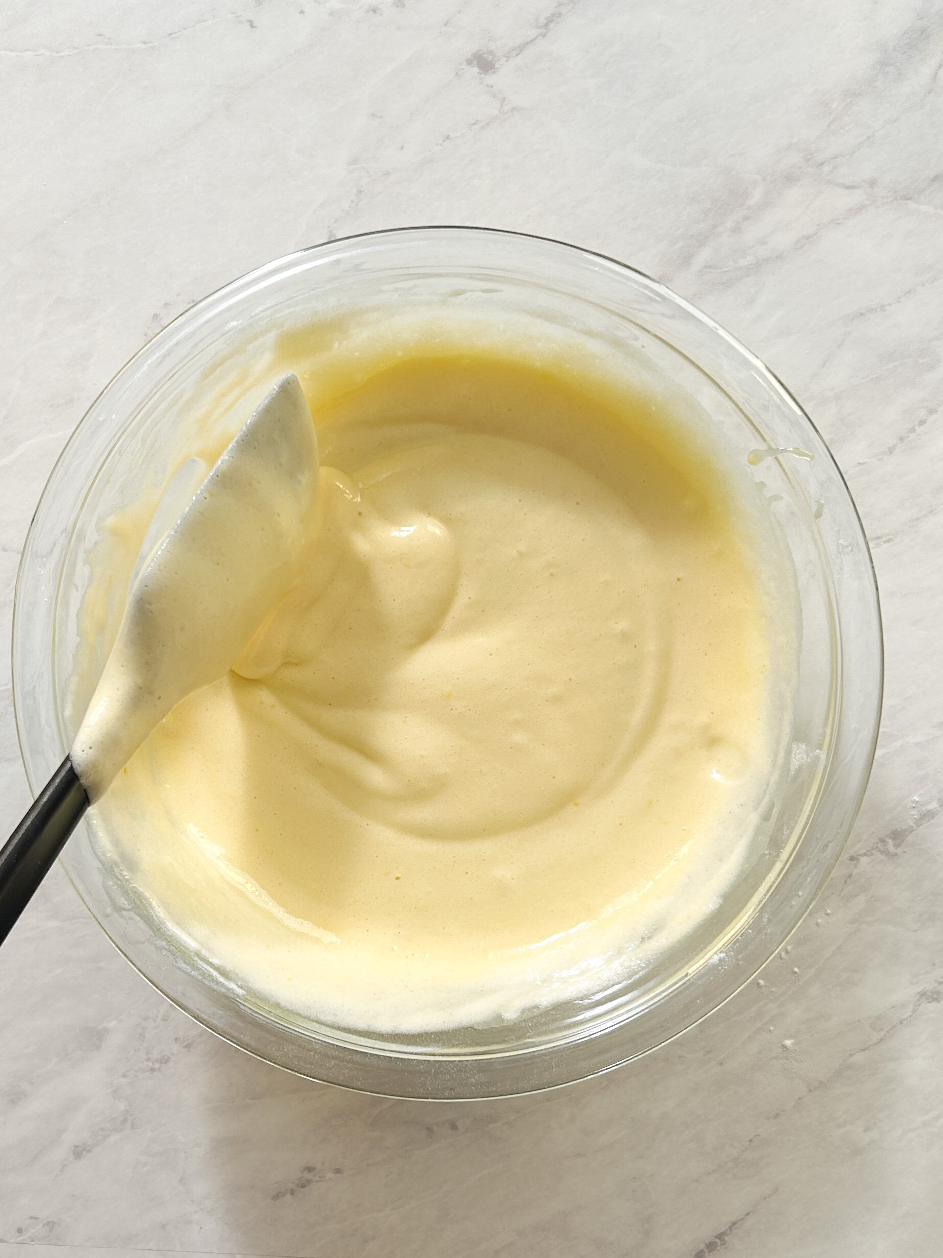 light and airy chiffon cake batter in a glass bowl