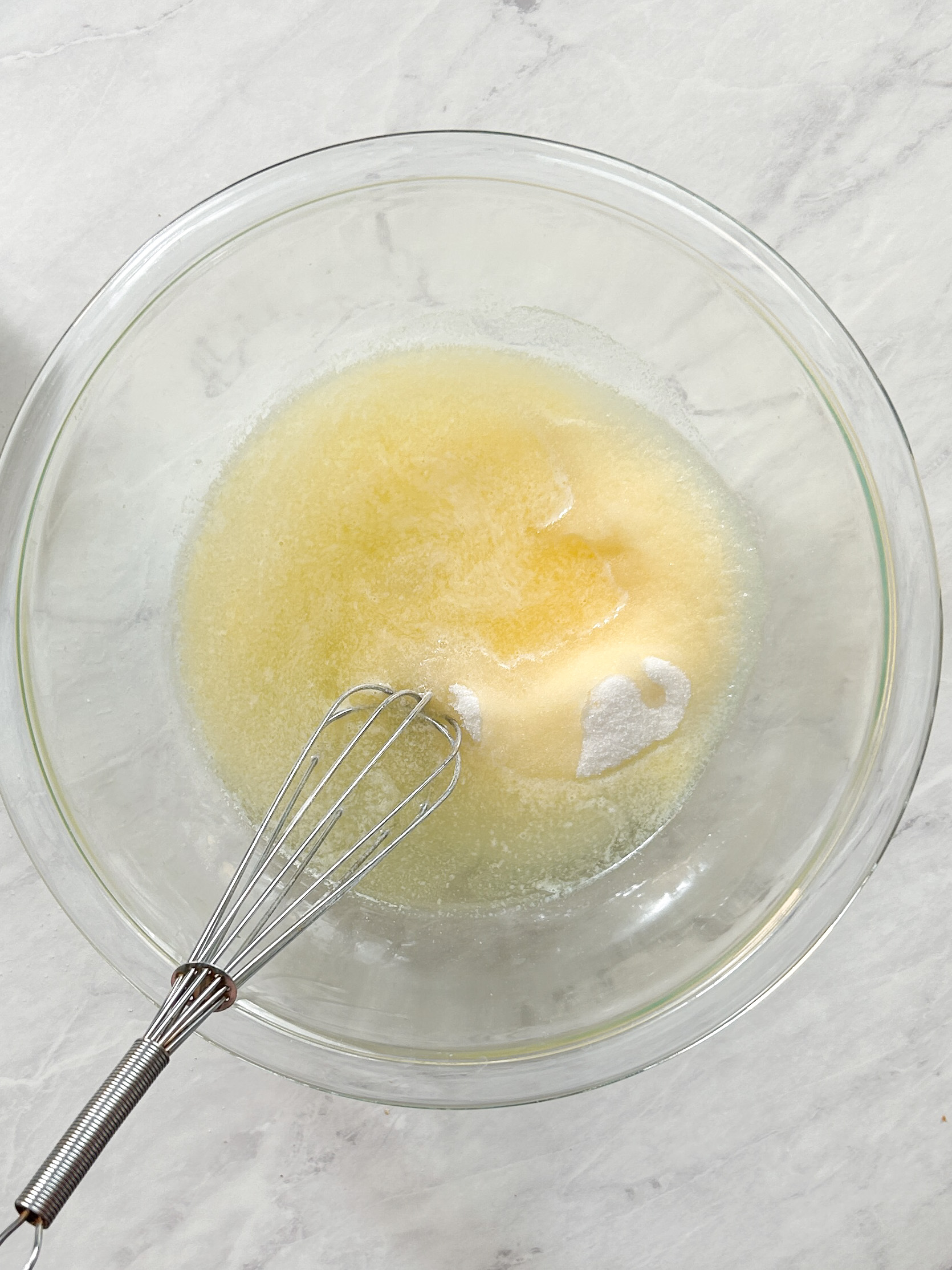 butter oil and sugar in a bowl