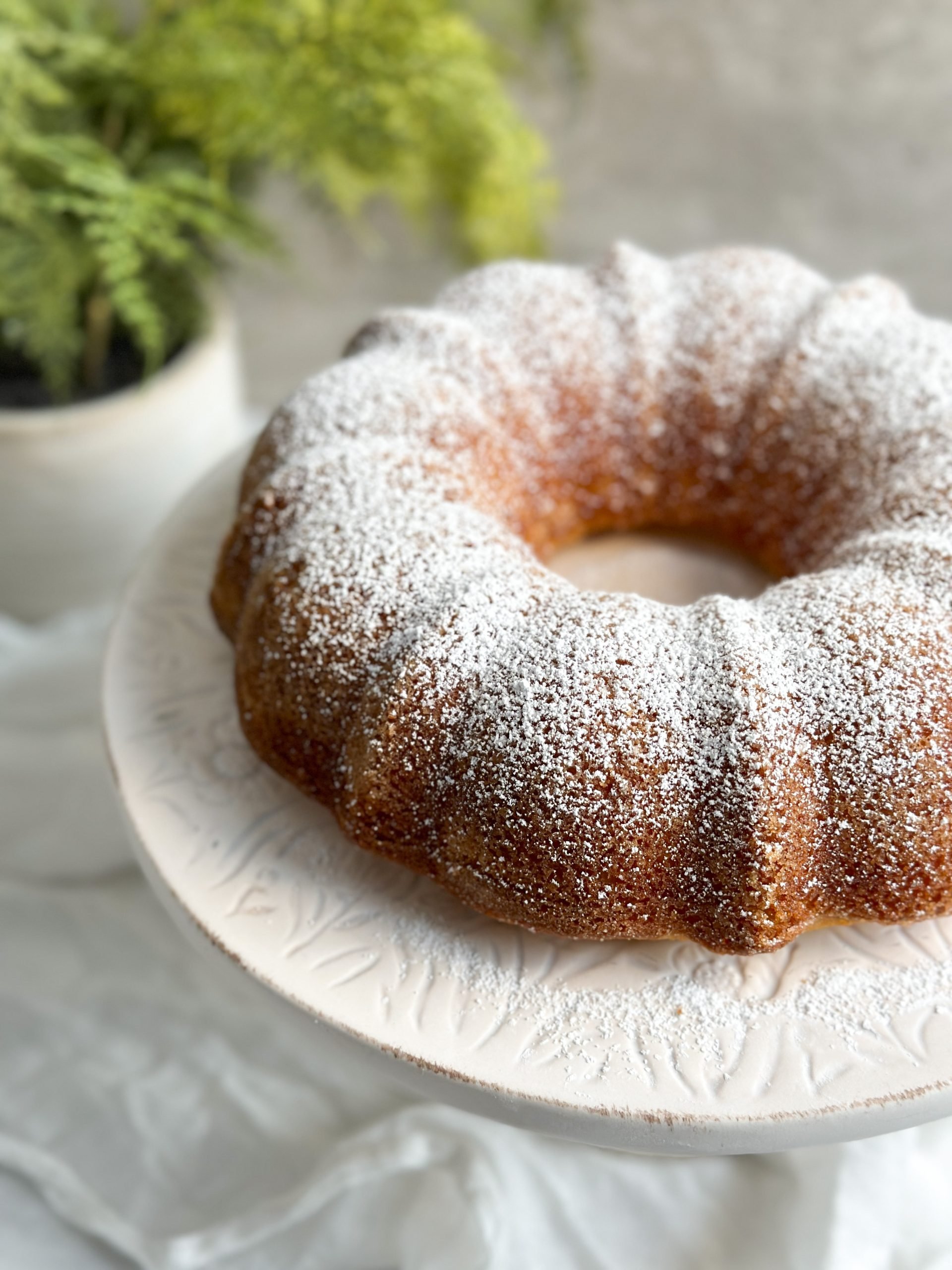 eggs mixed into butter and sugar to create cake batter. Dusted with powdered sugar