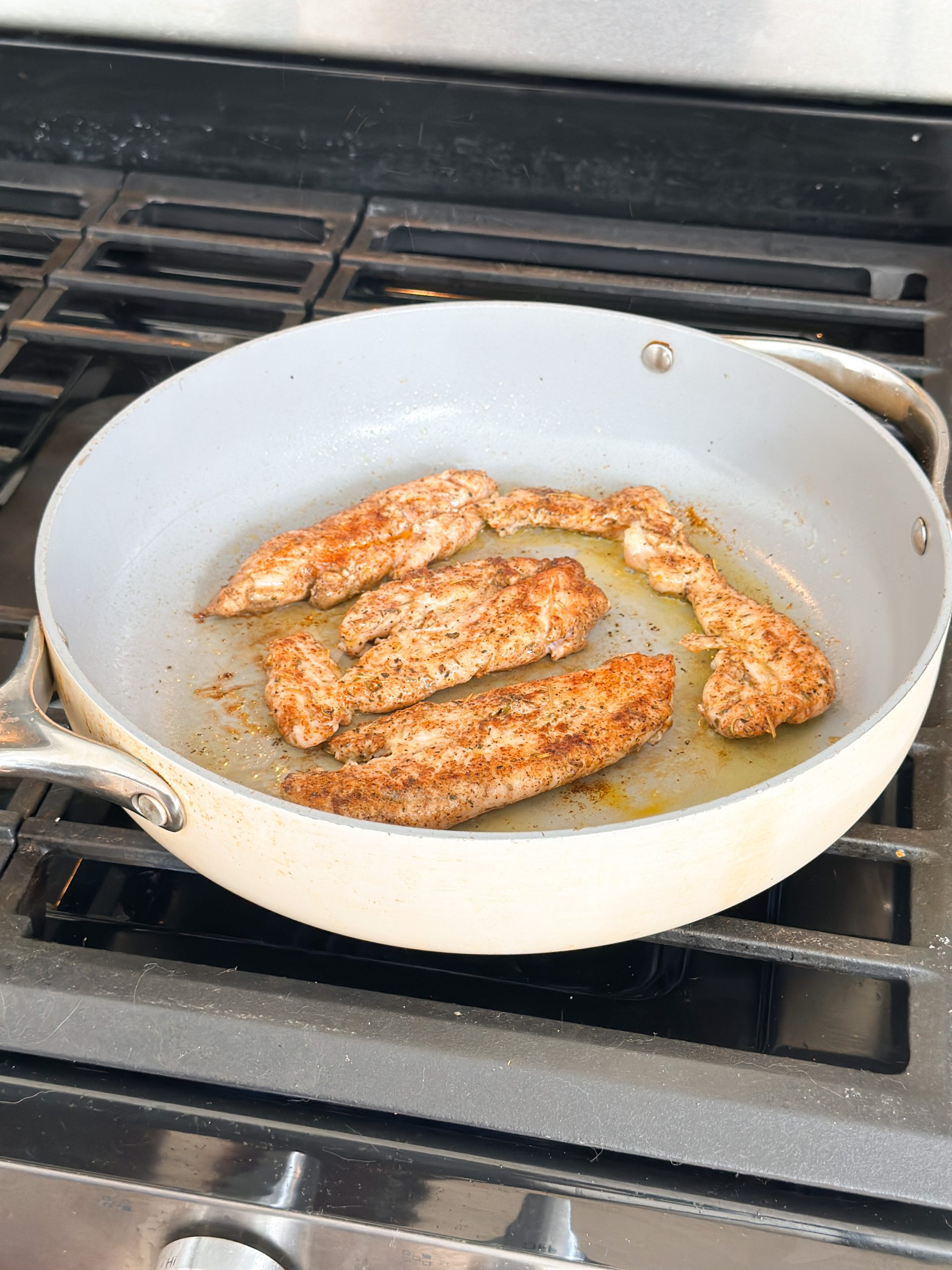 seared chicken tenders in a saute pan