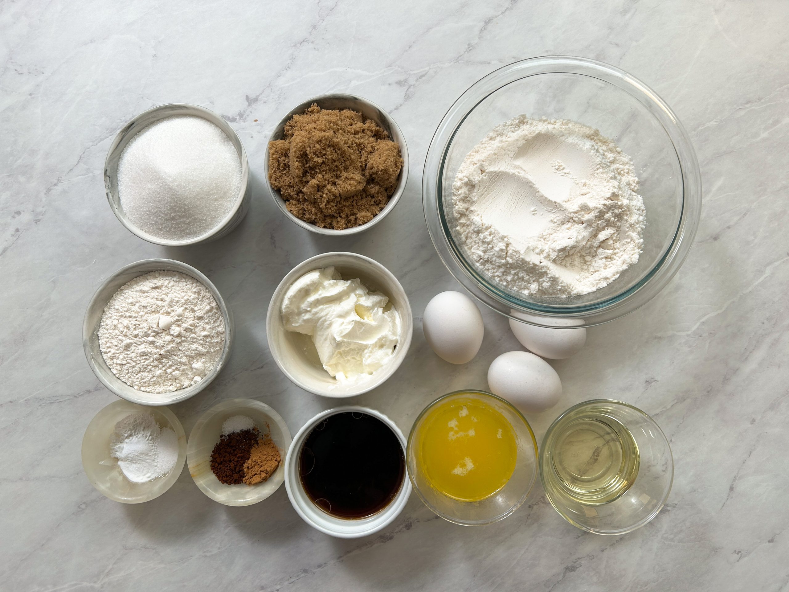 coffee cake ingredients placed in small bowls next to one another