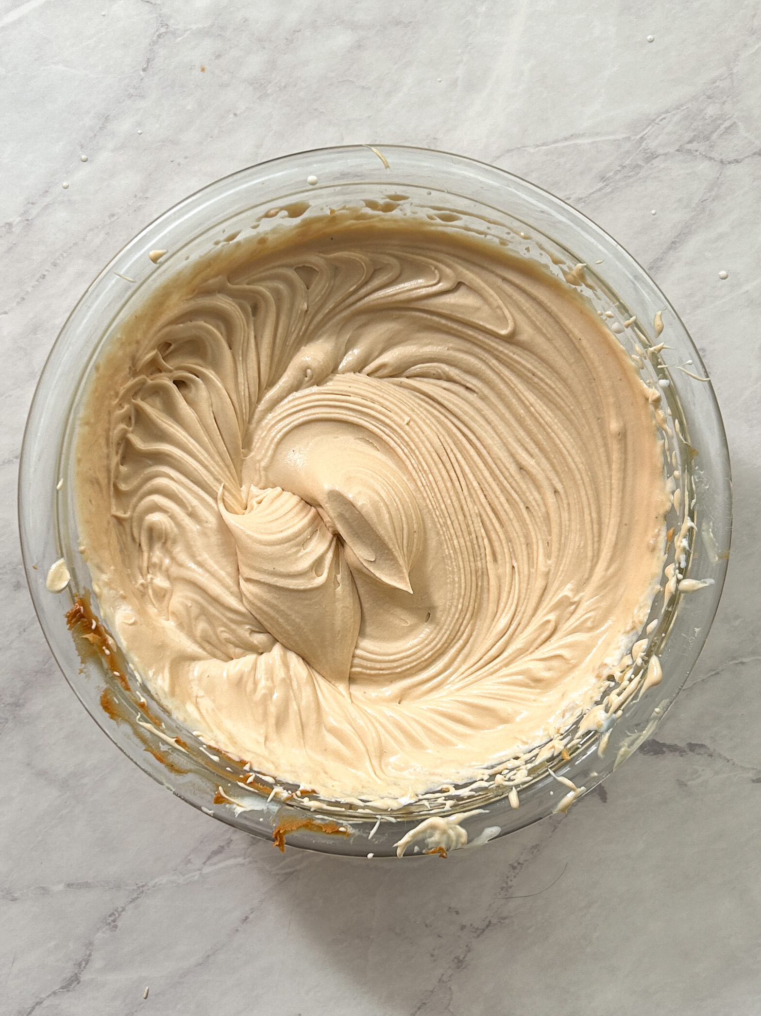 biscoff mascarpone cream whipped to stiff peaks in a glass bowl