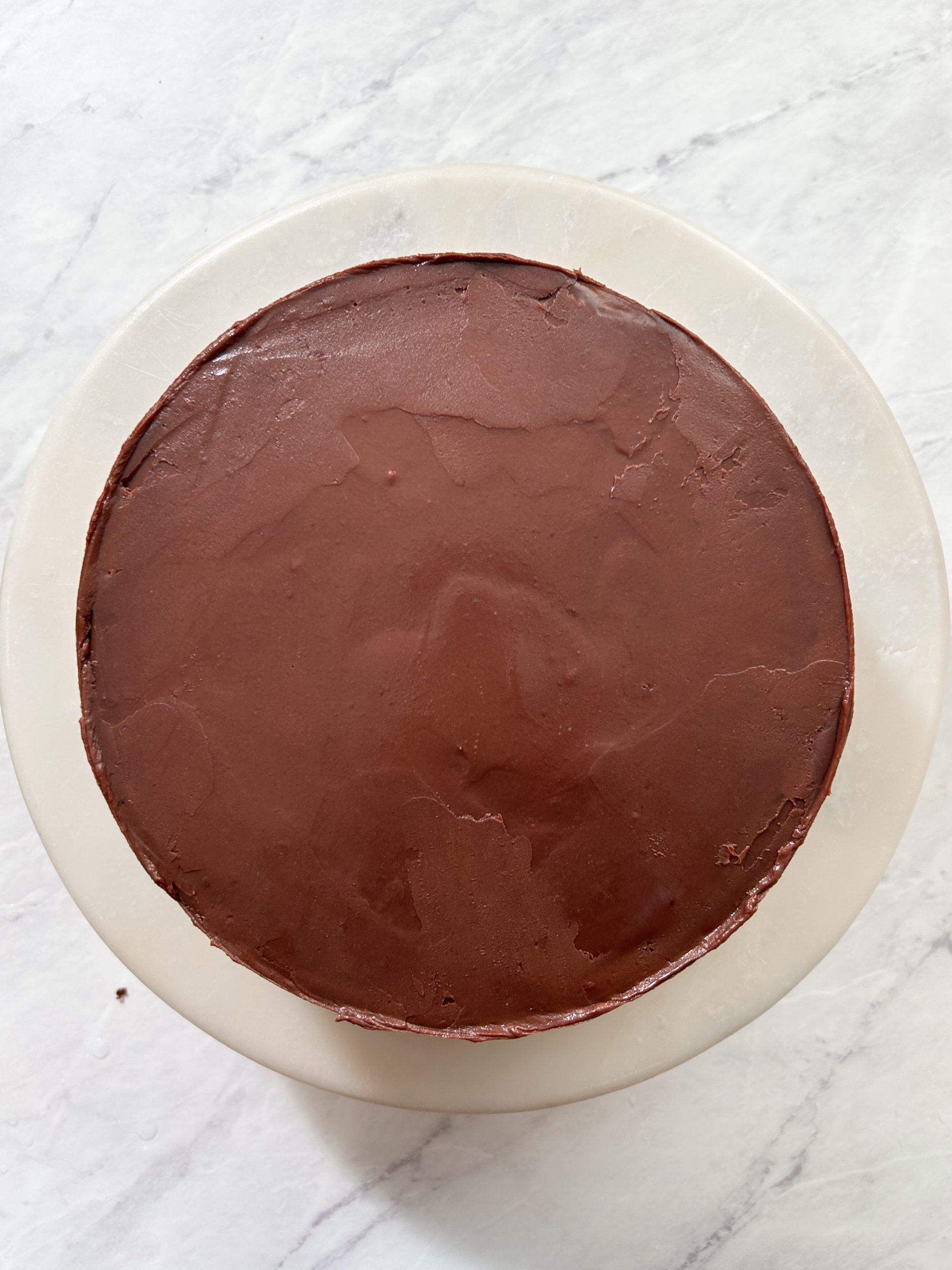 chocolate cake from the top covered in ganache