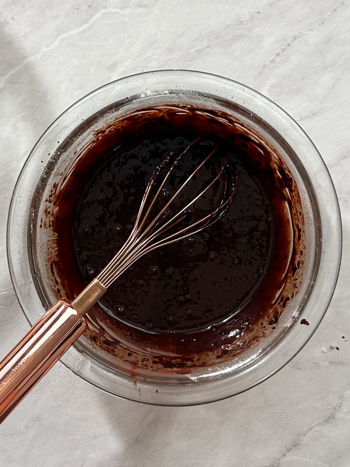 bloomed cocoa powder mixture in a small glass bowl