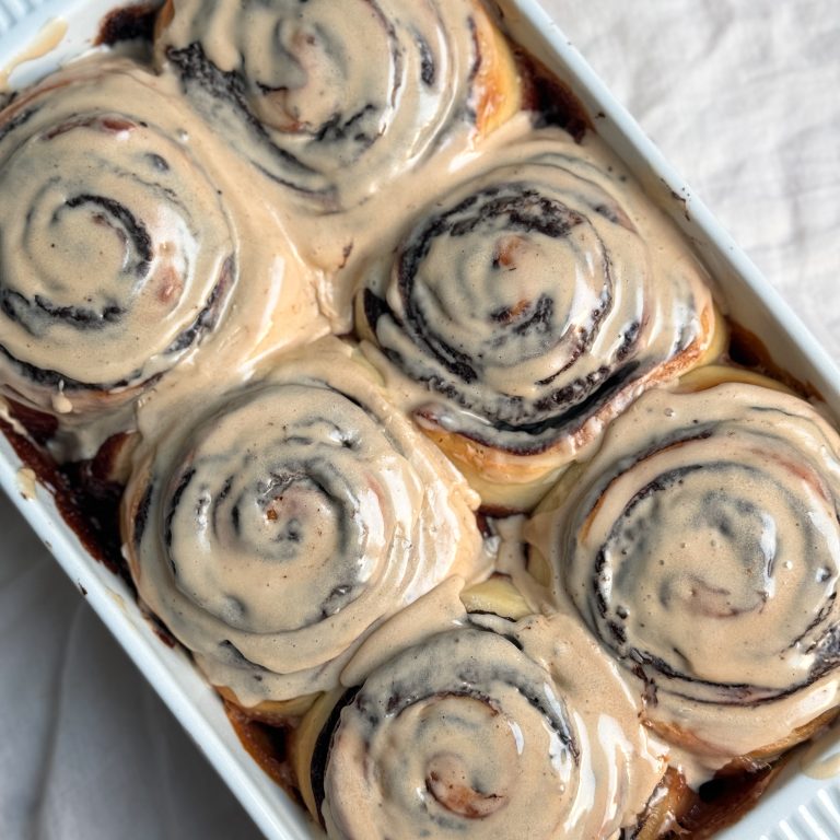 six chocolate espresso rolls covered with coffee icing