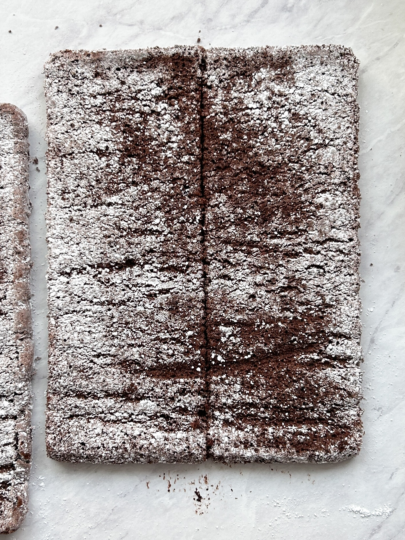 chocolate genoise sponge cake divided into 2 strips