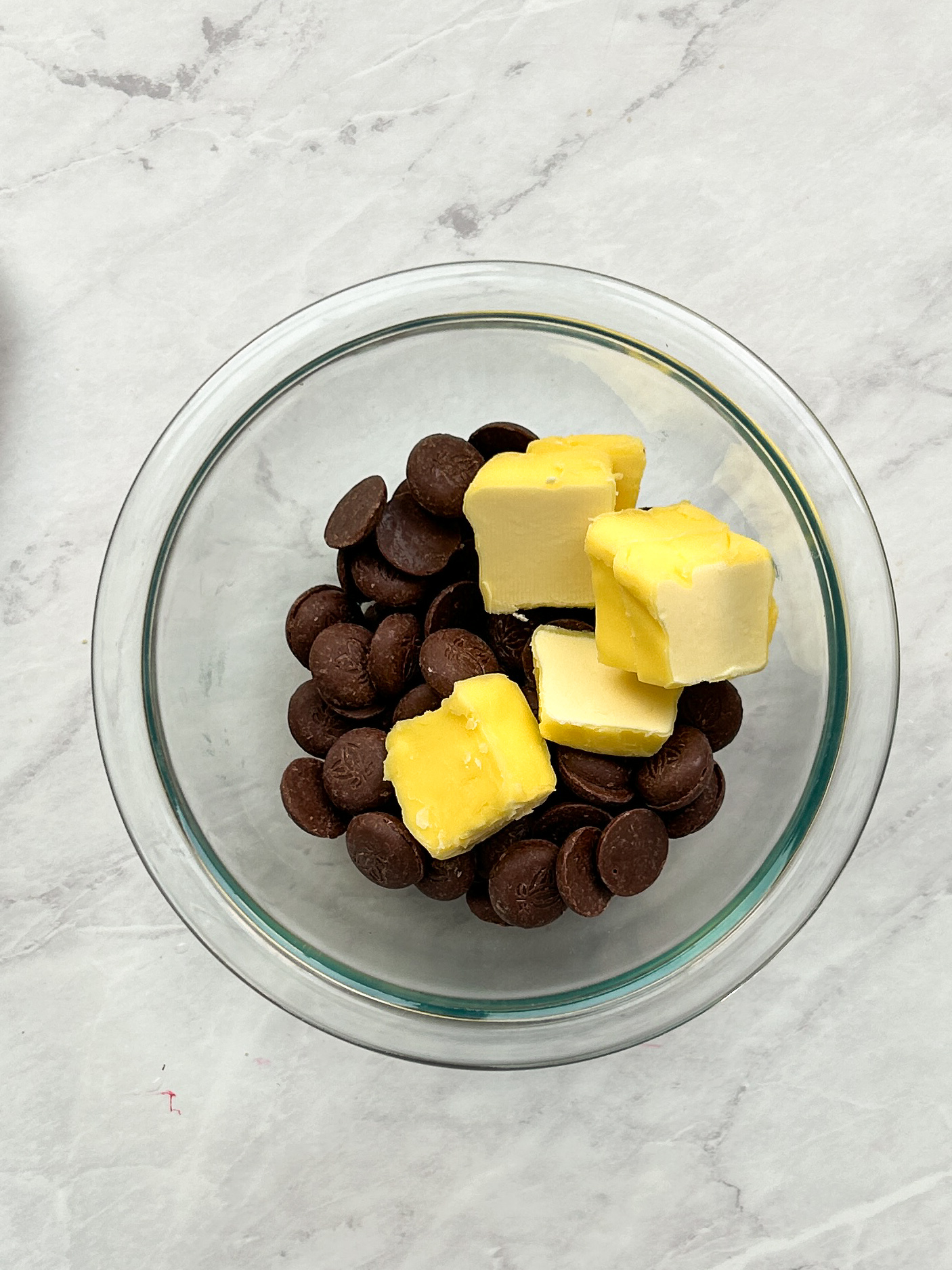 chocolate chips and butter in a glass bowl