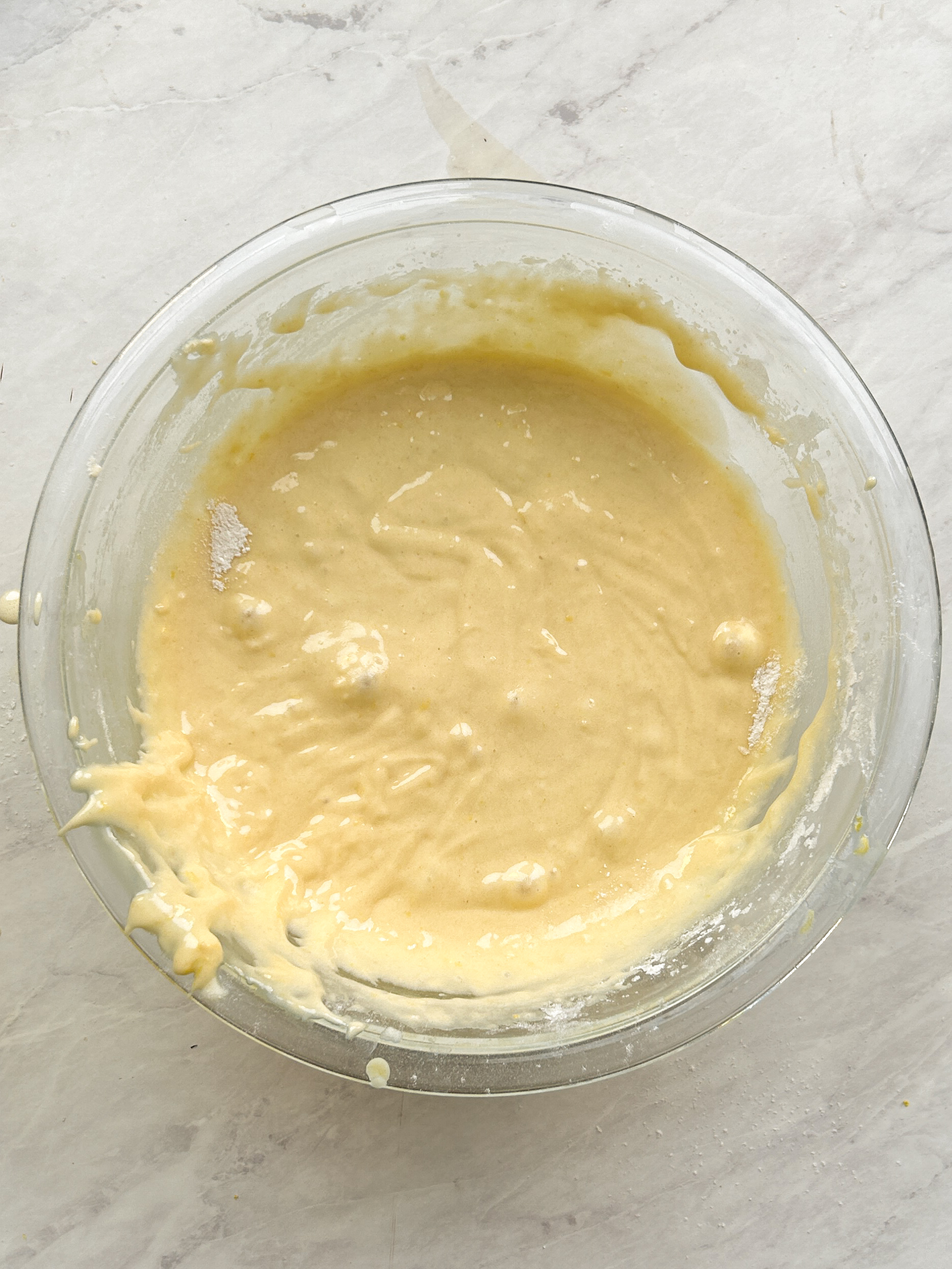 lemon loaf cake batter with dry ingredients combined