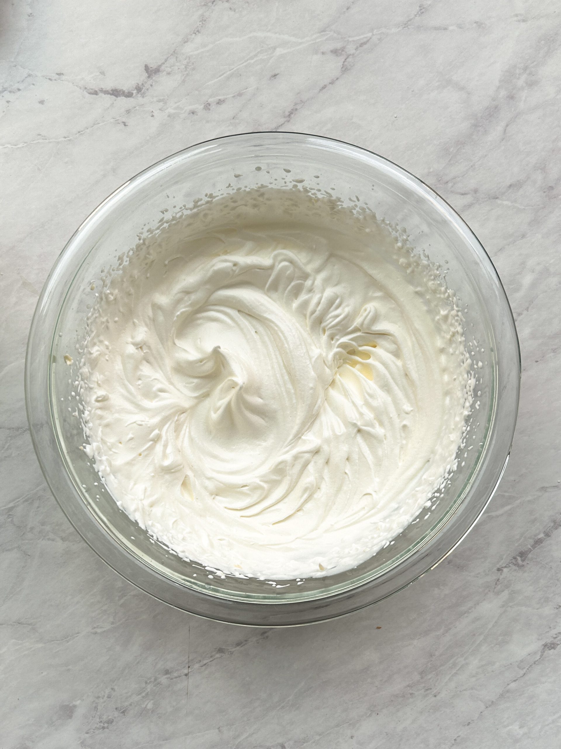whipped cream in a glass bowl