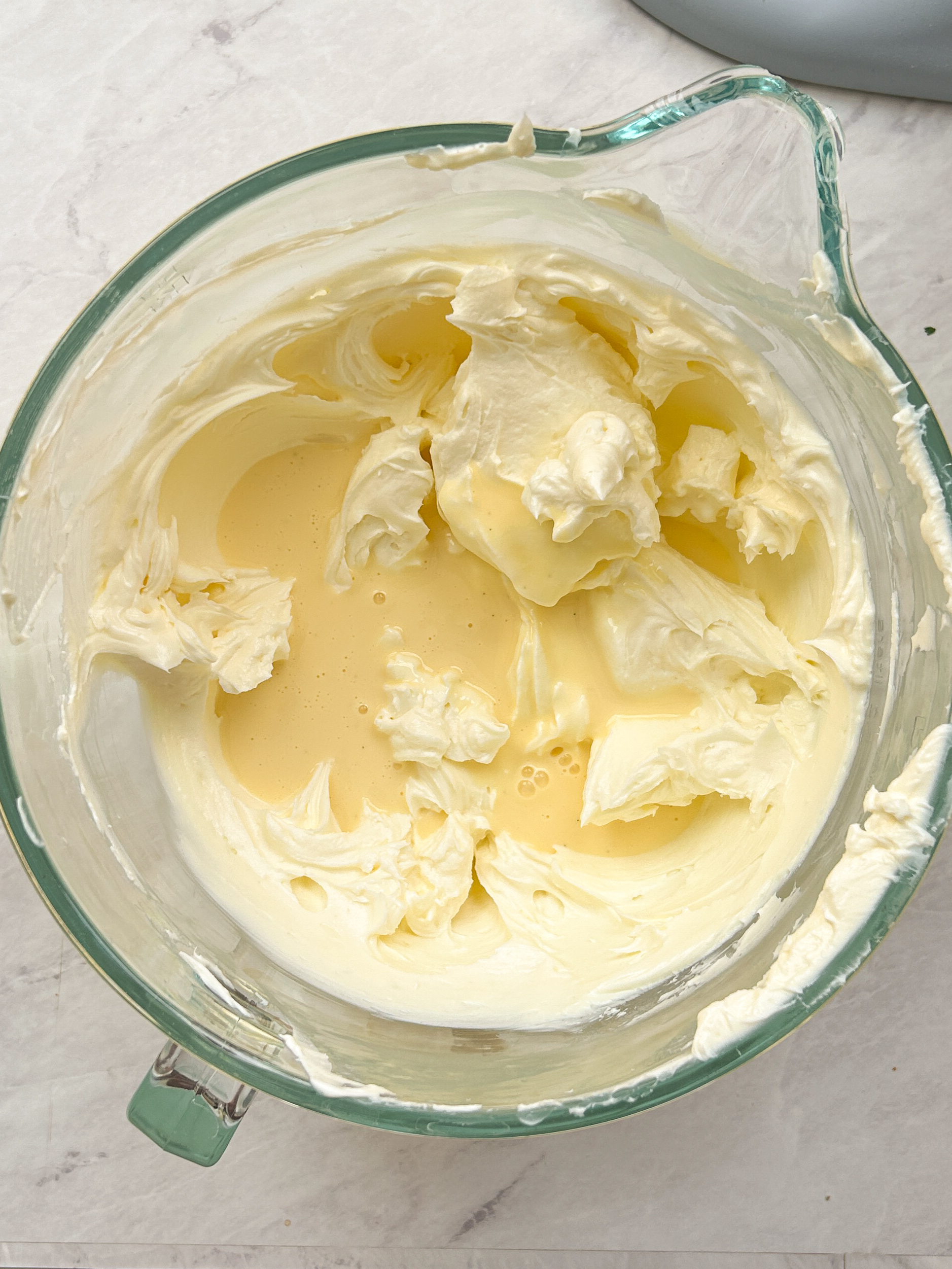 cream cheese and creme pat in a mixing bowl