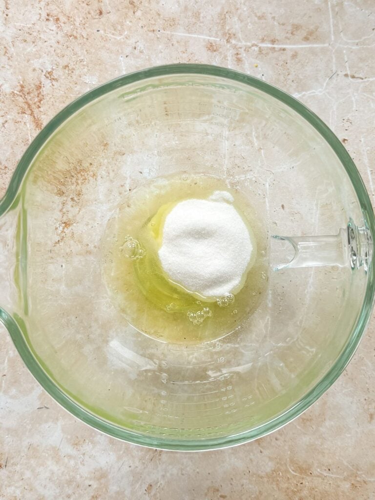 egg whites and sugar in a glass bowl