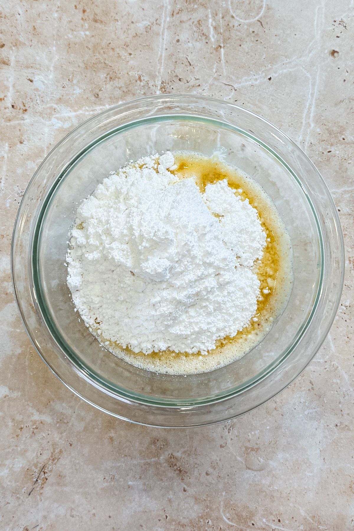 brown butter, cream cheese, cream and powdered sugar in a glass bowl