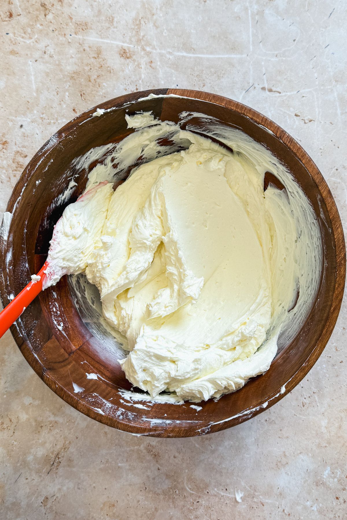 cream cheese mixed until creamy in a wooden bowl