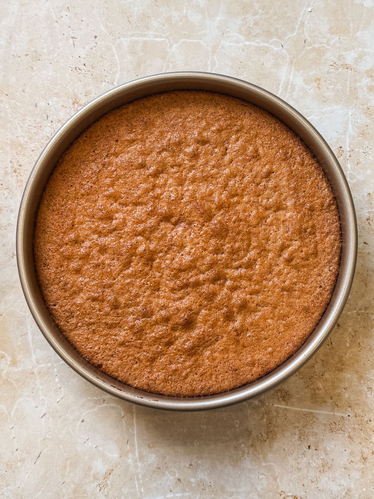 baked strawberry chiffon cake in a cake pan
