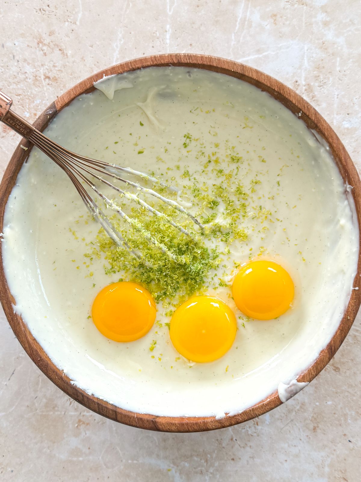 egg yolks and lime zest added to key lime filling mixture