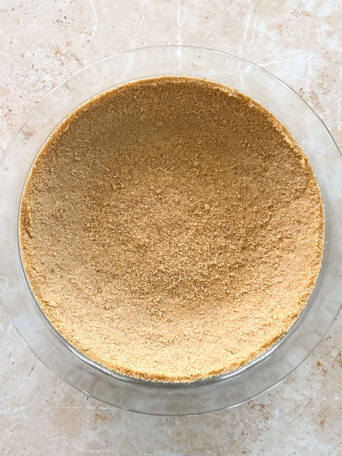 key lime pie crust in a pie pan