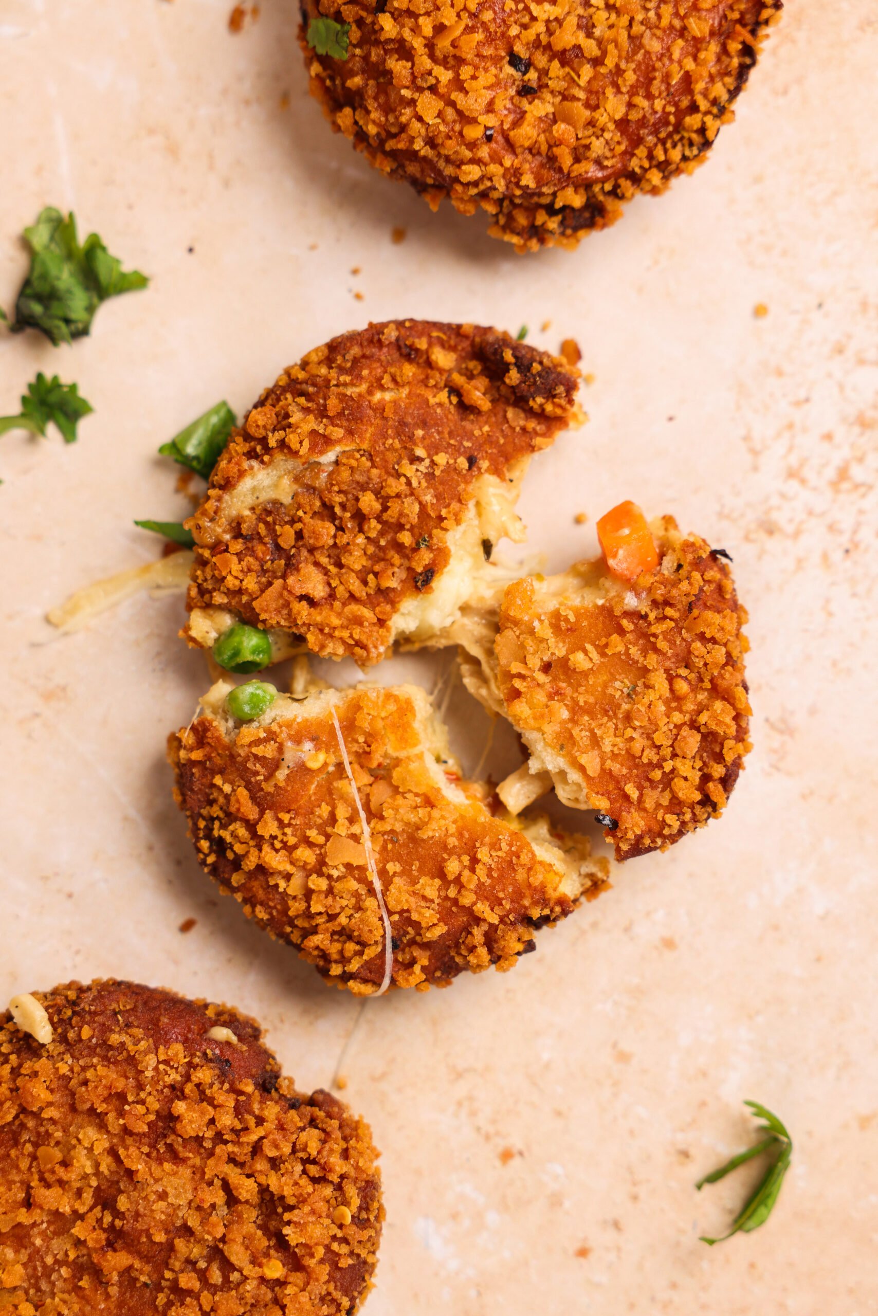 pot pie bread pocket broken into 3 pieces with cheese and filling oozing out