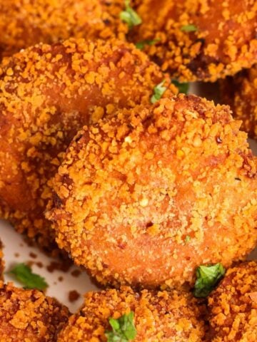 close up of golden and crunchy pot pie bread pockets with cilantro garnish