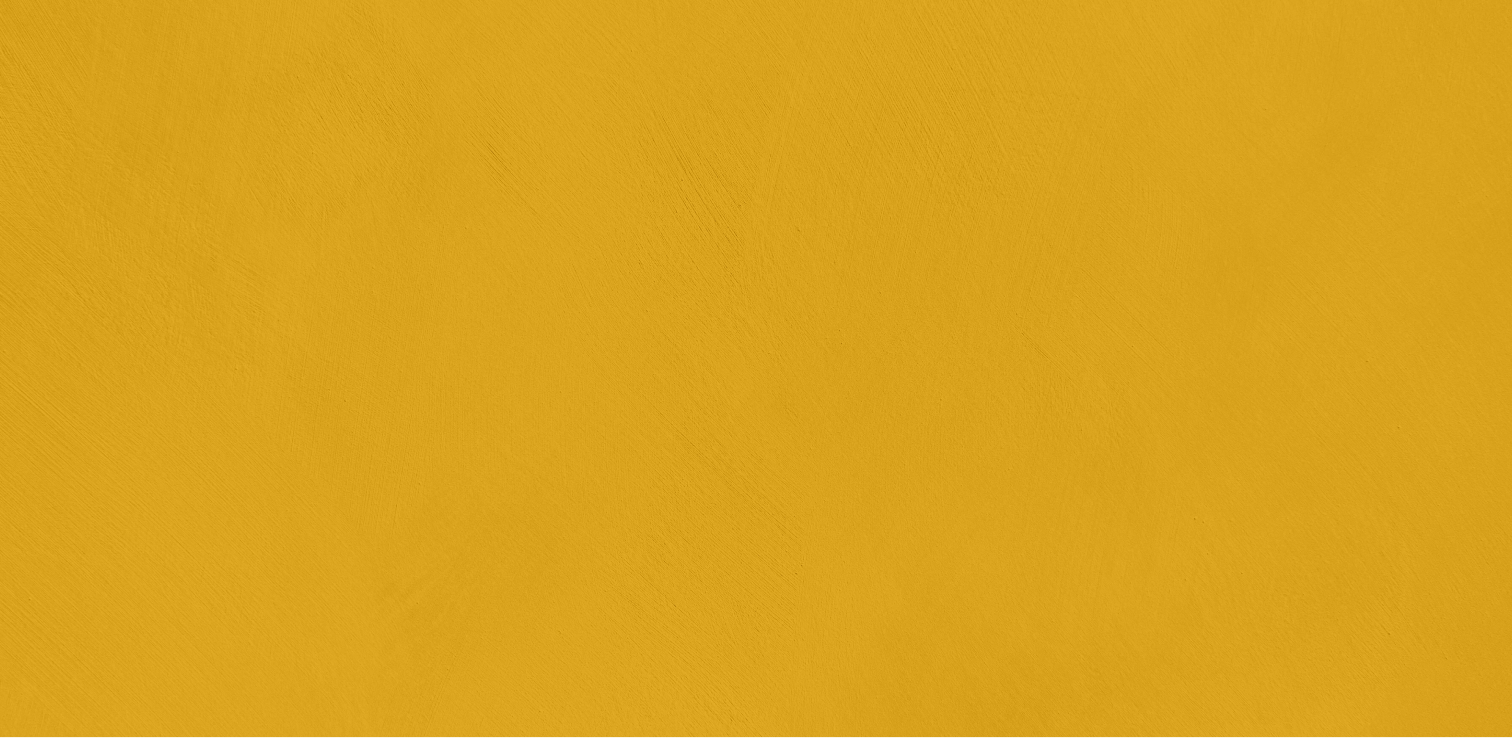 A plain background with a solid mustard yellow color and a slightly textured, brushed appearance.