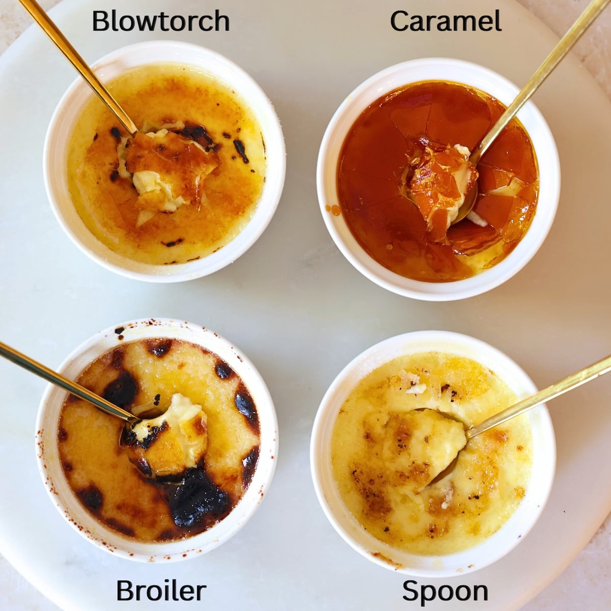 Four crème brûlées in white ramekins labeled Blowtorch, Caramel, Broiler, and Spoon, each with a gold spoon breaking the caramelized top. They show different textures and appearances of the sugar crust.