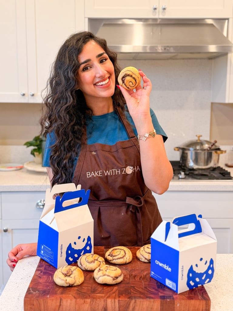 zoha holding cinnamon roll cookie